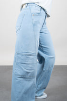 Lola Delicous Wideleg Wide Leg Fit Jeans Light Blue Denim Light Spring Summer. Model wears a Lola in the wash Delicious. It's a wide leg fit. Middle waist height. Premium denim. Comfortable denim. Comfortable jeans. All day wear.