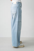 Lola Delicous Wideleg Wide Leg Fit Jeans Light Blue Denim Light Spring Summer. Model wears a Lola in the wash Delicious. It's a wide leg fit. Middle waist height. Premium denim. Comfortable denim. Comfortable jeans. All day wear. 