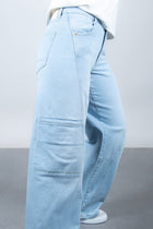 Lola Delicous Wideleg Wide Leg Fit Jeans Light Blue Denim Light Spring Summer. Model wears a Lola in the wash Delicious. It's a wide leg fit. Middle waist height. Premium denim. Comfortable denim. Comfortable jeans. All day wear.