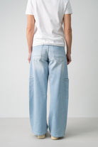 Lola Delicous Wideleg Wide Leg Fit Jeans Light Blue Denim Light Spring Summer. Model wears a Lola in the wash Delicious. It's a wide leg fit. Middle waist height. Premium denim. Comfortable denim. Comfortable jeans. All day wear. 